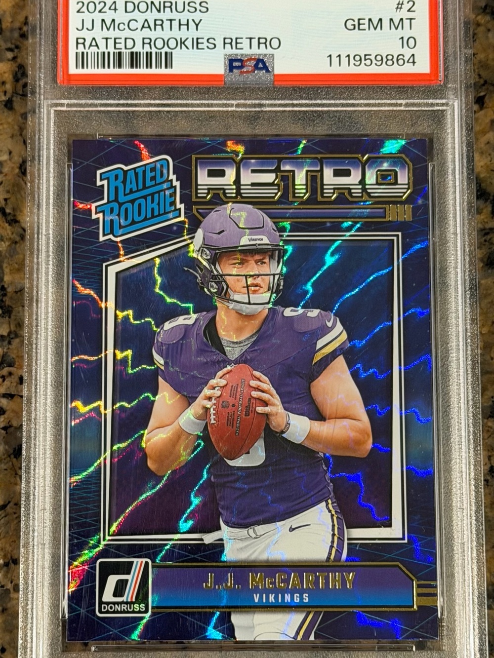 Panini Donruss Retro Rated Rookie Purple & Gold JJ McCarthy Football Card